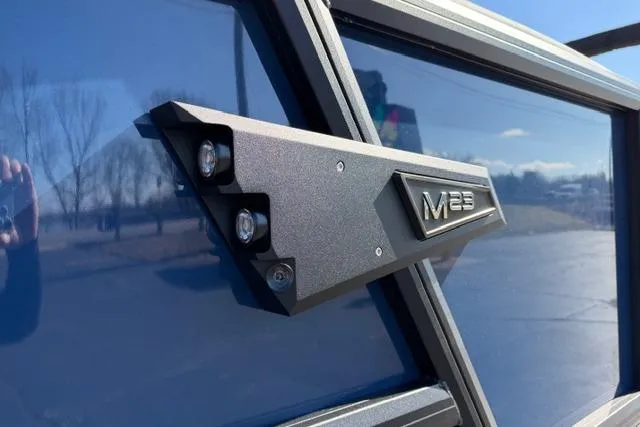 Slide: The Image of 2026 Alera M 23Q vehicle detail with sleek design and modern emblem. - 3