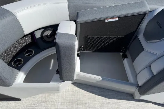 Slide: The Image of Interior of 2026 Alera M 23Q boat with storage compartment and cup holders. - 37