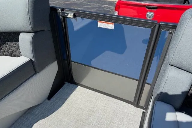 Slide: The Image of Interior view of 2026 Alera M 23Q boat with seating and safety gate. - 38