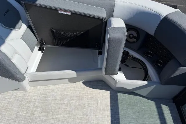Slide: The Image of Interior of 2026 Alera M 23Q boat with open storage compartment and seating. - 43