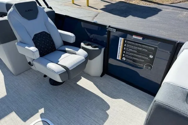 Slide: The Image of Luxury seating on 2026 Alera M 23Q boat with cup holders and safety instructions. - 44