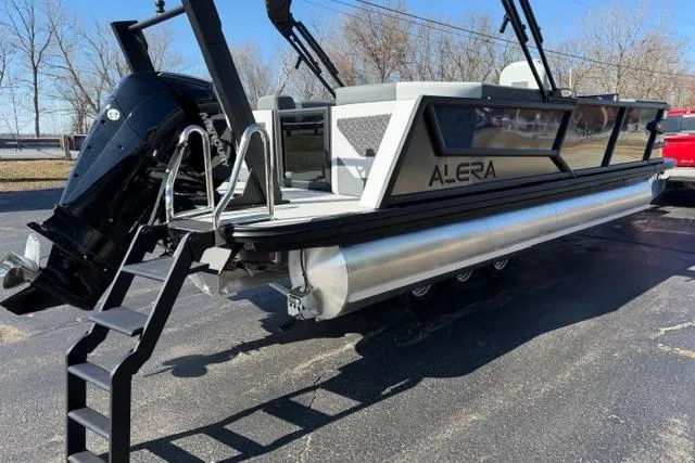 Slide: The Image of Alera M 23Q 2026 pontoon boat with sleek design and powerful outboard motor. - 8