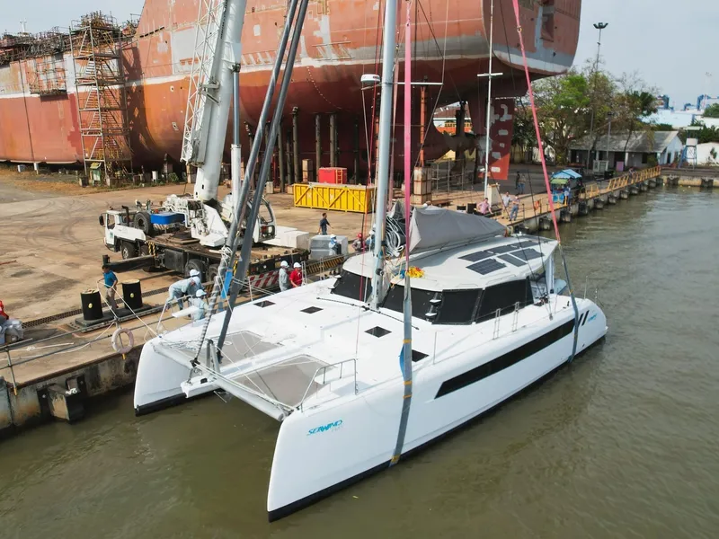 Slide: The Image of 2025 Seawind 1370 catamaran docked at a shipyard. - 5