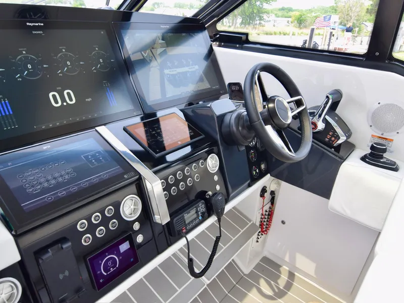 Slide: The Image of 2023 Formula 500 Super Sport Crossover helm with advanced navigation displays and controls. - 21