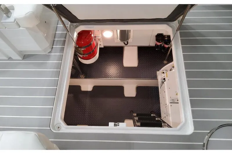 Slide: The Image of 2023 Formula 500 Super Sport Crossover engine compartment with fire extinguisher and equipment. - 48