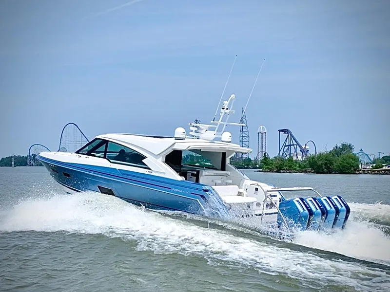 Slide: The Image of 2023 Formula 500 Super Sport Crossover cruising on water near amusement park. - 5