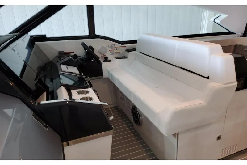 Slide: The Image of 2023 Formula 500 Super Sport Crossover interior with sleek white seating and modern dashboard. - 62