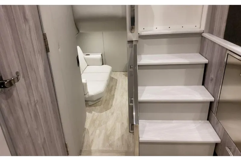 Slide: The Image of Interior of 2023 Formula 500 Super Sport Crossover, featuring modern stairs and seating area. - 67
