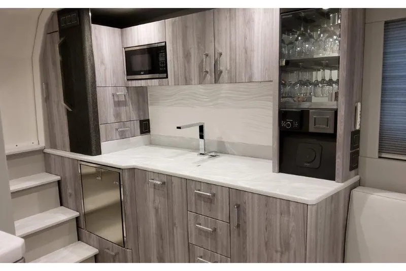 Slide: The Image of 2023 Formula 500 Super Sport Crossover interior kitchen with modern cabinetry and appliances. - 73