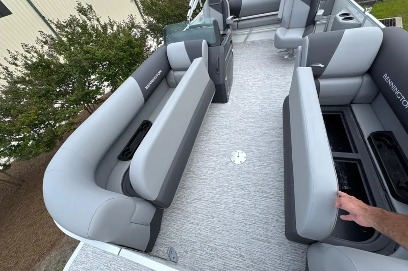 Slide: The Image of 2026 Bennington 22 SSB pontoon boat interior with gray seating and storage compartments. - 10