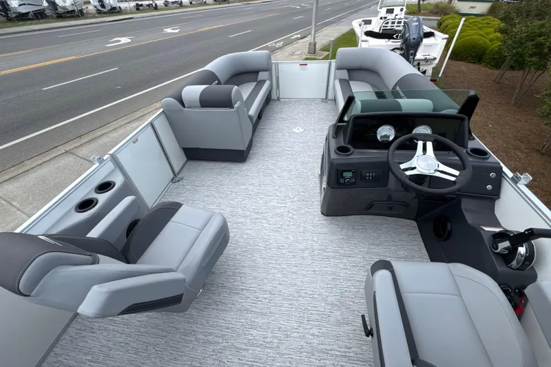 Slide: The Image of 2026 Bennington 22 SSB pontoon boat interior with modern seating and steering console. - 12