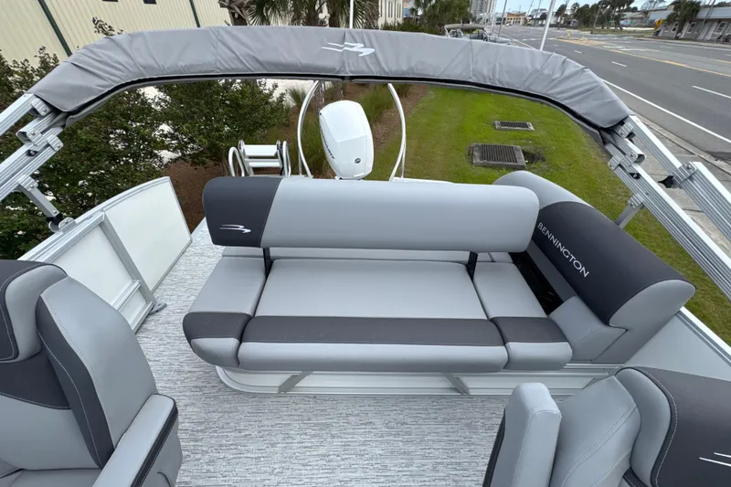 Slide: The Image of 2026 Bennington 22 SSB pontoon boat with sleek gray seating and canopy. - 15