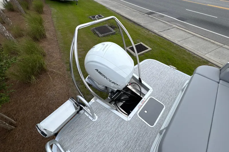 Slide: The Image of 2026 Bennington 22 SSB boat with Mercury outboard motor, viewed from above. - 16