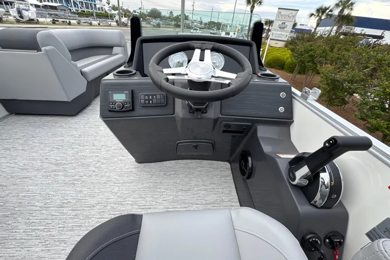 Slide: The Image of 2026 Bennington 22 SSB boat cockpit with steering wheel and control panel. - 18