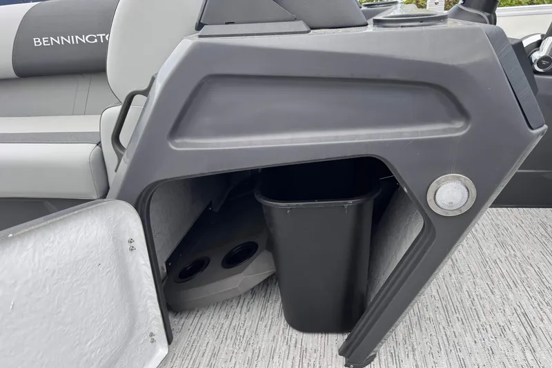 Slide: The Image of Interior storage compartment of 2026 Bennington 22 SSB boat with trash bin. - 19