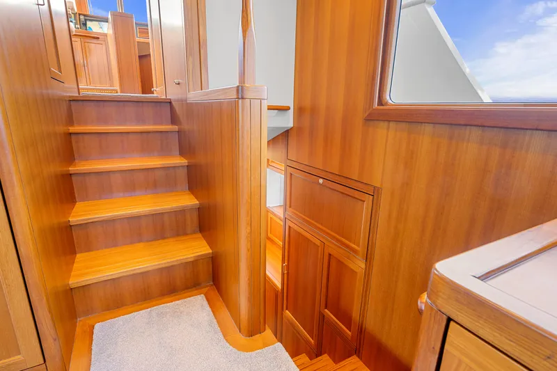 Slide: The Image of Interior of 2023 Fleming 85 yacht with wooden stairs and cabinetry. - 10