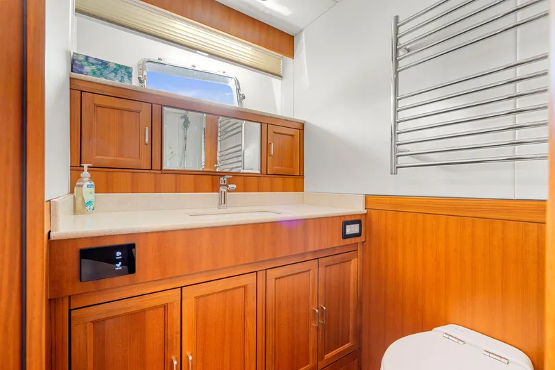 Slide: The Image of Luxurious bathroom in 2023 Fleming 85 yacht with wooden cabinetry and modern fixtures. - 13