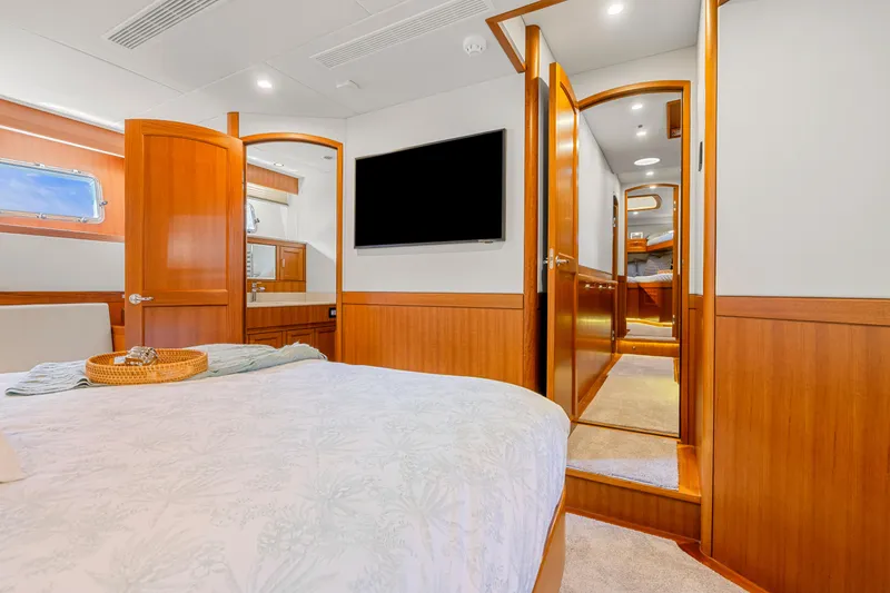 Slide: The Image of Luxurious cabin interior of 2023 Fleming 85 yacht with wooden finishes and modern amenities. - 15