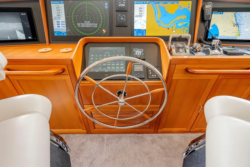 Slide: The Image of Helm of 2023 Fleming 85 yacht with advanced navigation displays and controls. - 33