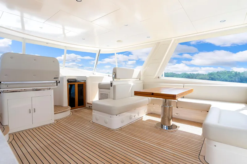 Slide: The Image of Luxurious interior of 2023 Fleming 85 yacht with elegant seating and panoramic windows. - 36