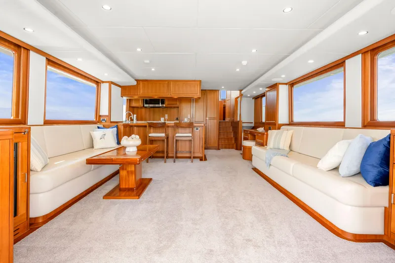 Slide: The Image of Luxurious interior of 2023 Fleming 85 yacht with elegant seating and wooden accents. - 4