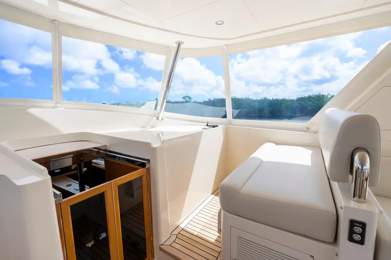Slide: The Image of Luxurious interior of 2023 Fleming 85 yacht with panoramic windows and plush seating. - 40