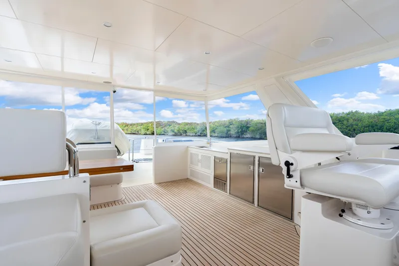 Slide: The Image of Luxurious interior of 2023 Fleming 85 yacht with white seating and scenic views. - 42