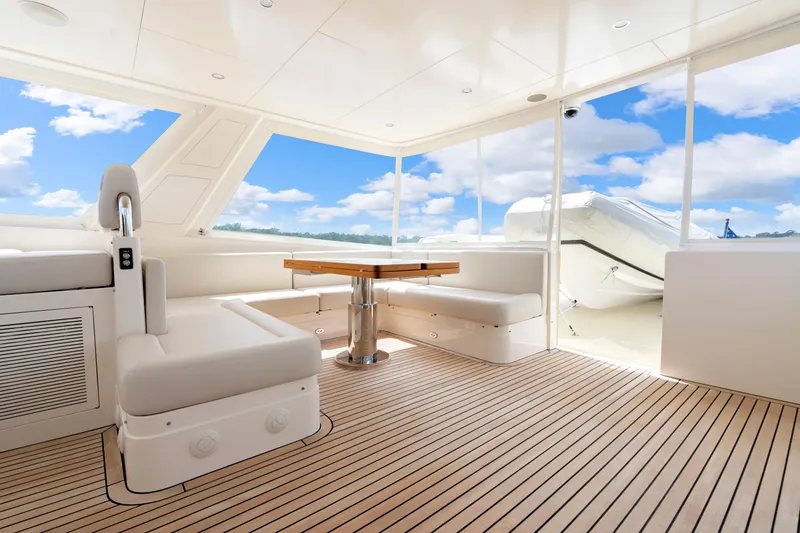 Slide: The Image of Luxurious 2023 Fleming 85 yacht interior with elegant seating and wooden flooring. - 43
