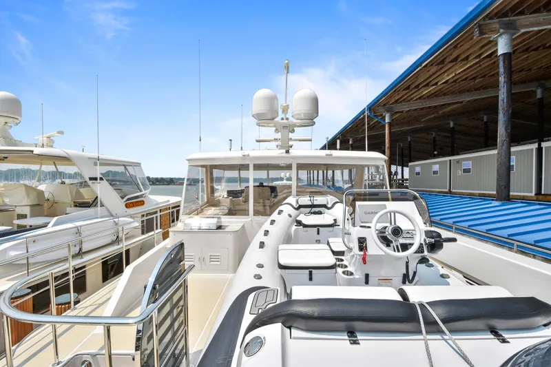 Slide: The Image of Luxury Fleming 85 yacht docked at marina, showcasing sleek design and modern amenities, 2023 model. - 46