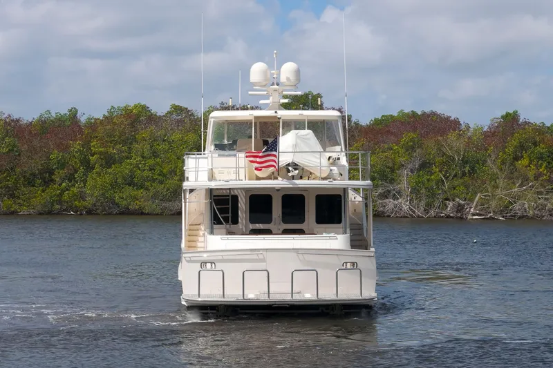 Slide: The Image of Luxury Fleming 85 yacht cruising on a serene waterway, 2023 model. - 48