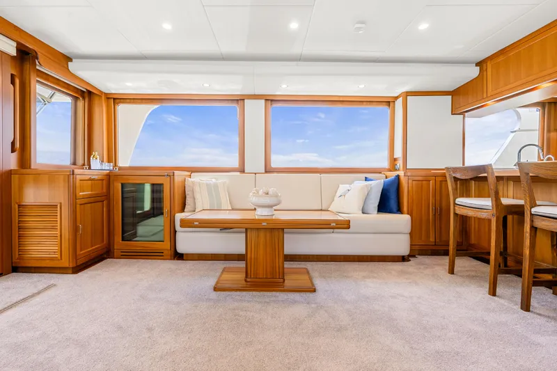 Slide: The Image of Luxurious interior of 2023 Fleming 85 yacht with elegant wood finishes and plush seating. - 5