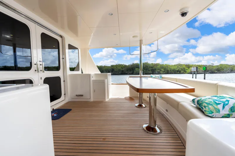 Slide: The Image of Spacious deck of 2023 Fleming 85 yacht with elegant seating and scenic water view. - 52