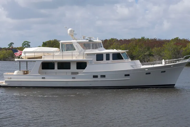 Slide: The Image of Luxury Fleming 85 yacht cruising on a calm river, 2023 model. - 56