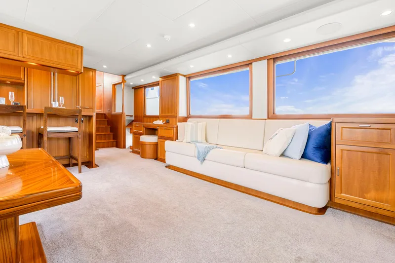 Slide: The Image of Luxurious interior of 2023 Fleming 85 yacht with elegant wood finishes and plush seating. - 6