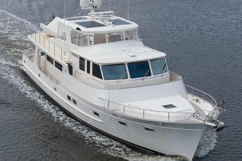 Slide: The Image of Luxurious 2023 Fleming 85 yacht cruising on open water. - 61