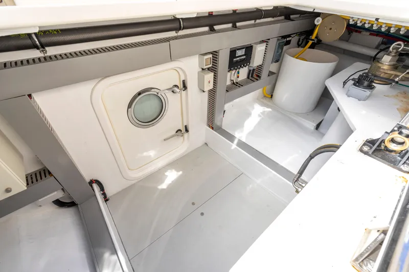 Slide: The Image of Engine room of 2023 Fleming 85 yacht with control panels and equipment. - 71