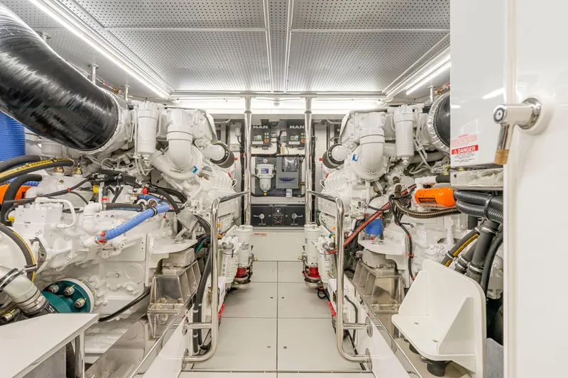 Slide: The Image of Engine room of 2023 Fleming 85 yacht, featuring advanced machinery and equipment. - 73