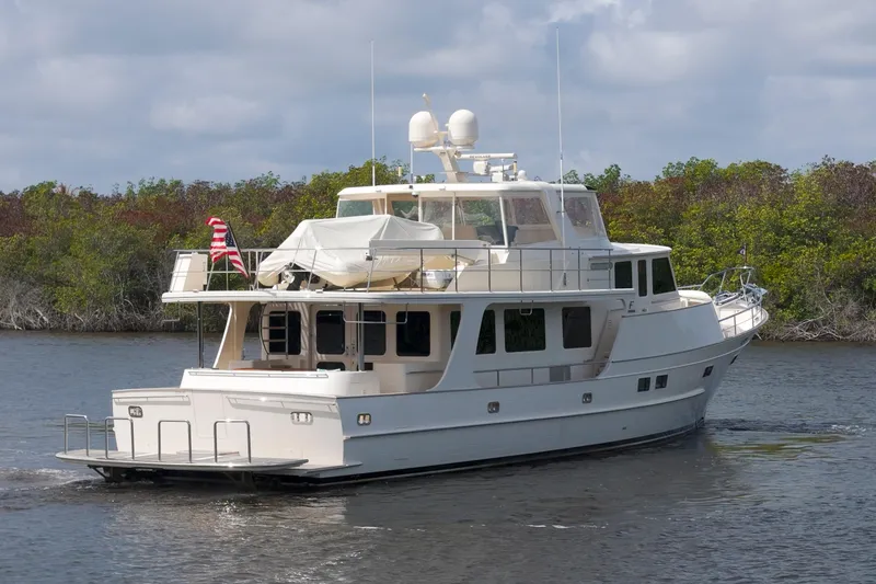 Slide: The Image of Luxury Fleming 85 yacht cruising on a serene waterway, 2023 model. - 78