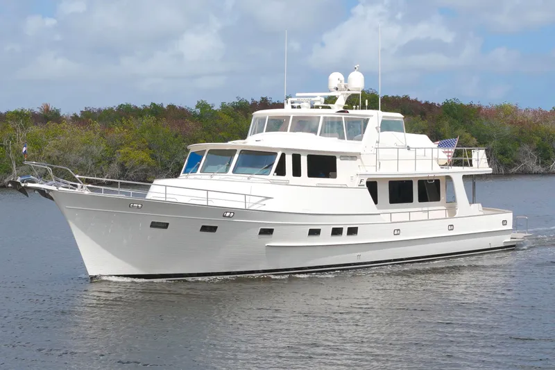 Slide: The Image of Luxury Fleming 85 yacht cruising on a serene waterway, 2023 model. - 80