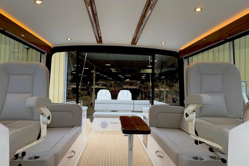 Slide: The Image of Luxurious interior of 2026 MJM 38x yacht with plush seating and modern design. - 4