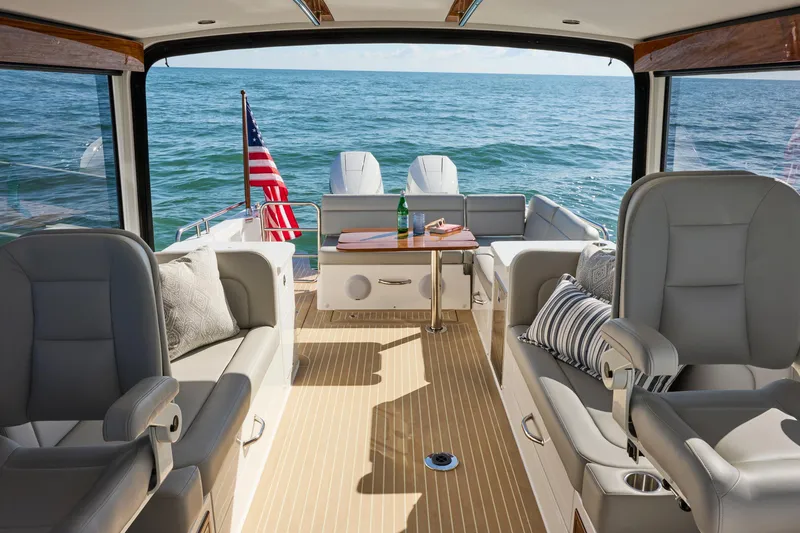 Slide: The Image of Luxurious 2026 MJM 38x yacht interior with elegant seating and ocean view. - 7