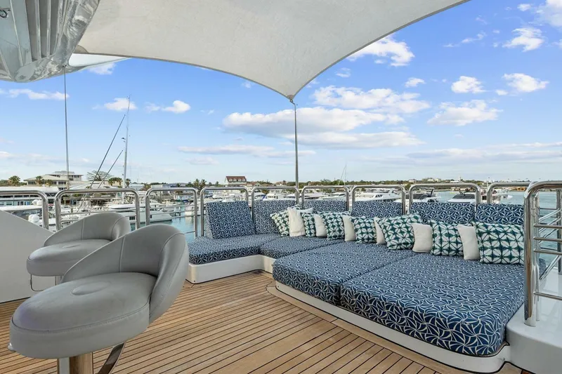 Slide: The Image of Luxurious deck seating on 2005 New Zealand Yachts 115 Wave Piercer, marina view. - 18