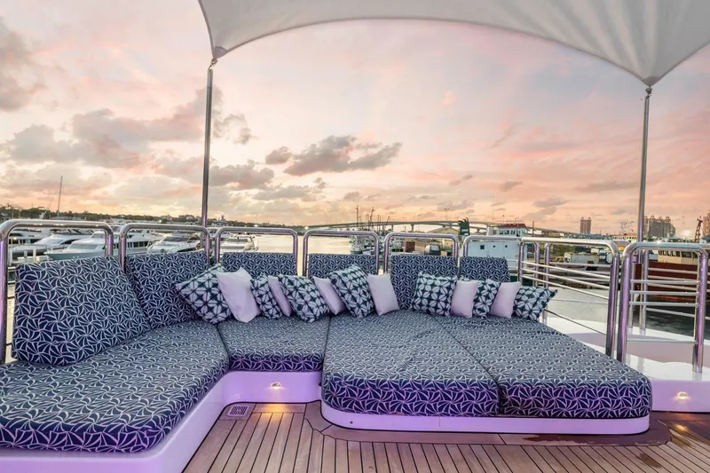 Slide: The Image of Luxurious deck seating on 2005 New Zealand Yachts 115 Wave Piercer at sunset. - 19