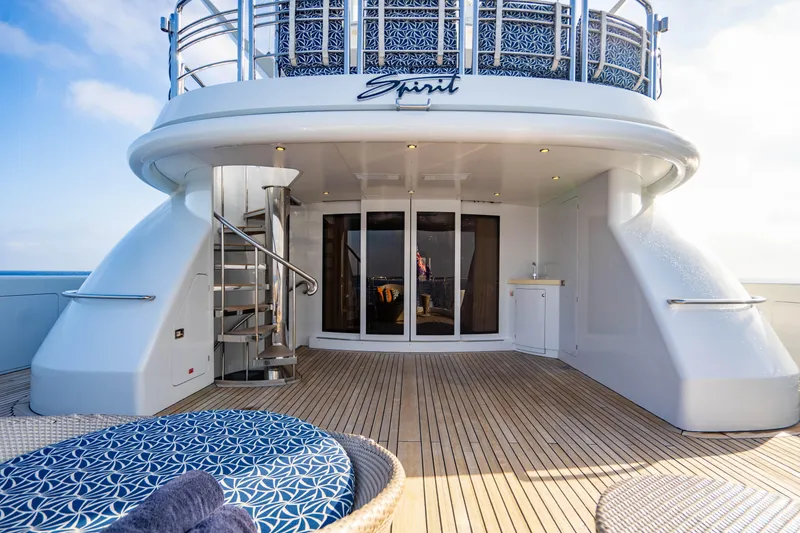 Slide: The Image of Luxurious 2005 New Zealand Yachts 115 Wave Piercer deck with elegant seating and spiral staircase. - 27