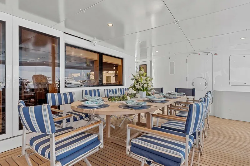 Slide: The Image of Luxurious dining area on 2005 New Zealand Yachts 115 Wave Piercer, featuring elegant table setting. - 31