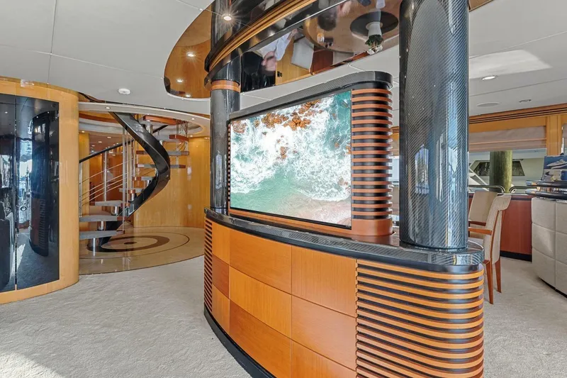 Slide: The Image of Luxurious interior of 2005 New Zealand Yachts 115 Wave Piercer with modern design and spiral staircase. - 35