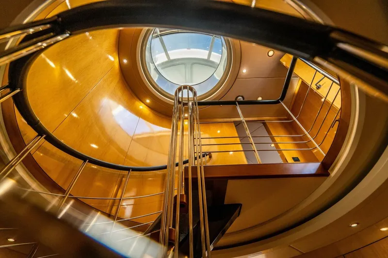 Slide: The Image of Interior view of 2005 New Zealand Yachts 115 Wave Piercer, featuring elegant wooden staircase. - 40