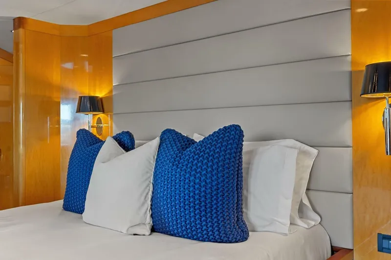 Slide: The Image of Luxurious bedroom interior on 2005 New Zealand Yachts 115 Wave Piercer, featuring blue pillows. - 44