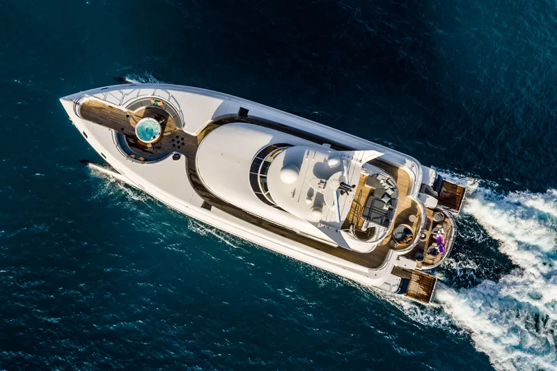 Slide: The Image of Aerial view of 2005 New Zealand Yachts 115 Wave Piercer cruising on blue ocean waters. - 5