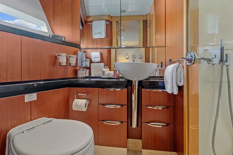 Slide: The Image of Luxurious yacht bathroom with modern fixtures, wooden cabinetry, and elegant sink on New Zealand Yachts 115 Wave Piercer. - 57